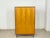 For sale is a beautiful wardrobe from the 1960s. The wardrobe impresses with its simple design, warm birchwood finish, and...