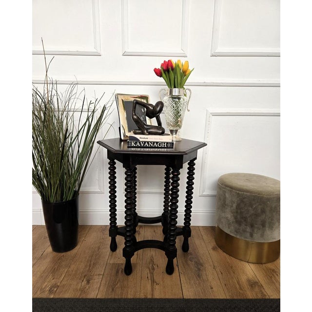 Beautiful antique Italian solid walnut side table, features hexagonal top with beveled edges over six beautifully bobbin...
