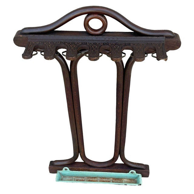 Edwardian era English pool cue stand is made from bent beechwood with cast iron turnstiles that rotate horizontally and...