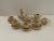 This Childs Tea set has a raised gold design and gold rims, It is 17 pieces. Two Coffee/tea pots, strainer, creamer, two...