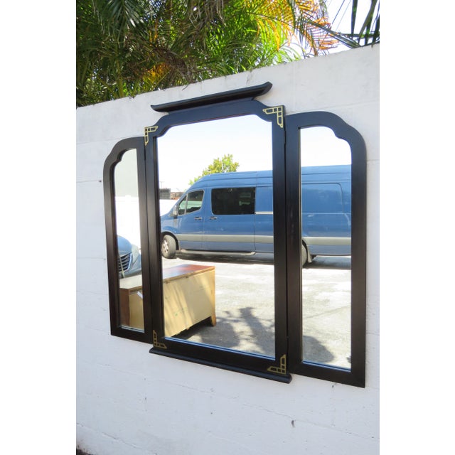 This gorgeous Mirror is made of wood, metal, and mirror. The Mirror was made by Bassett Furniture, and it is labeled. This...