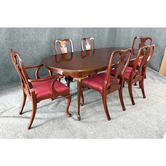 This Hickory Chair 7-piece dining set is crafted from solid mahogany and features a classic oval dining table paired with...