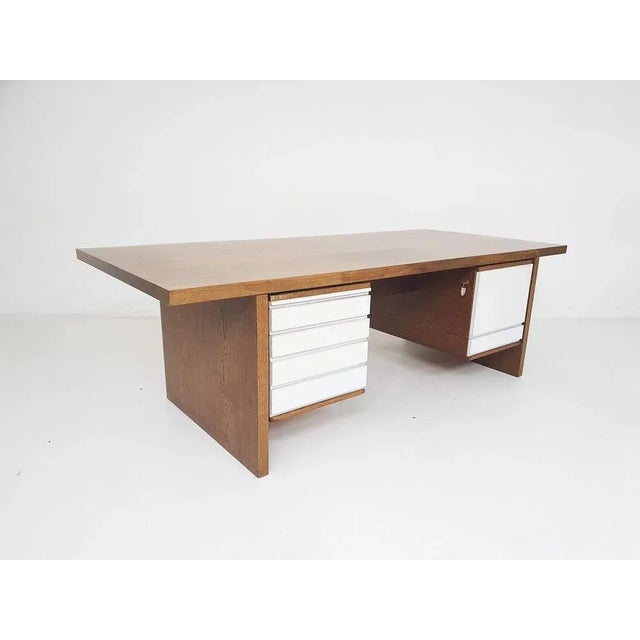 Large heavy executive desk in wenge and white formica. In good original condition, with some discoloration on the top. The...