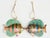 Pair of cloisonné enameled fish on gold metallic thread. Coloration may vary based on the nature of the materials and...