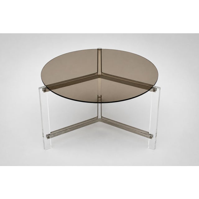 Vintage round coffee table of smoked glass and acrylic glass – 1970s Elegant vintage coffee table from the 1970s featuring...