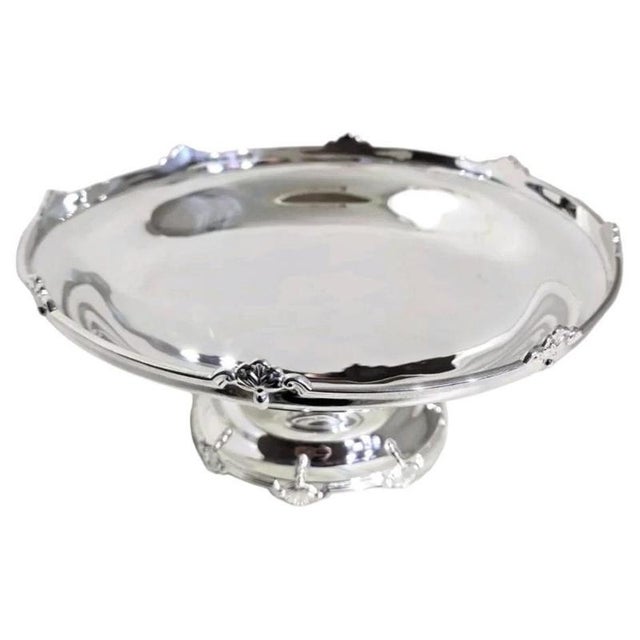 A fine George V sterling silver cake stand, compotier or table centre dating to 1932, displaying an elegant combination of...