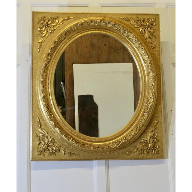 Large Very Decorative Gilt Oval Panel Mirror This is an outstanding piece, the oval central mirror is set in a rectangular...