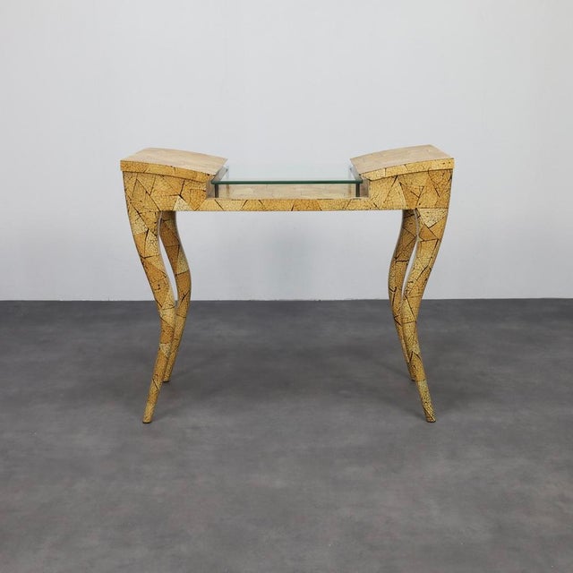 This sculptural console table by parisian design duo ria and yiouri augousti (r&y augousti) dates from the 1990s and...