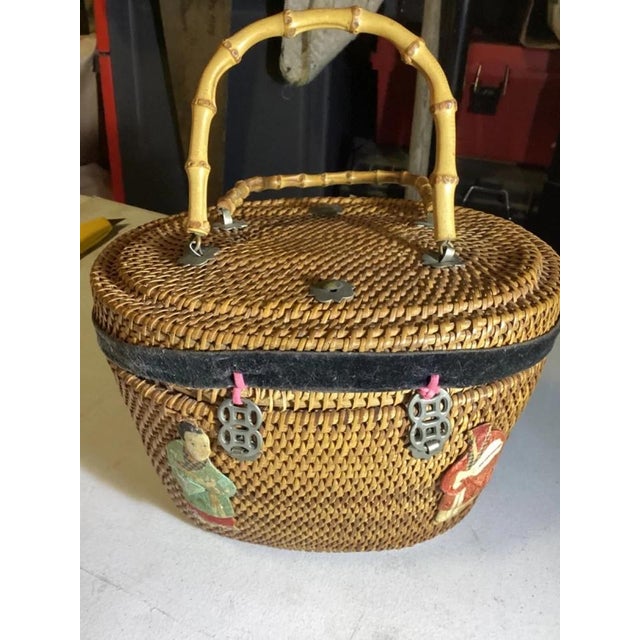 This antique Chinese woven wedding basket showcases traditional craftsmanship with its beautifully woven construction and...