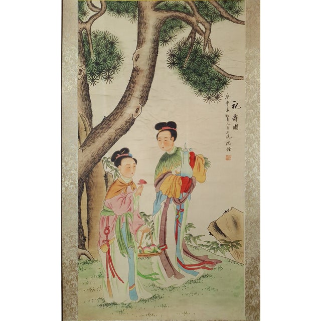 Chinese forest maidens scene scroll, finely drawn and detailed in colored inks on paper, mounted on a silk brocade...