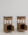 A pair of oak side tables with marble tops and sturdy frames. The combination of materials provides contrast and...