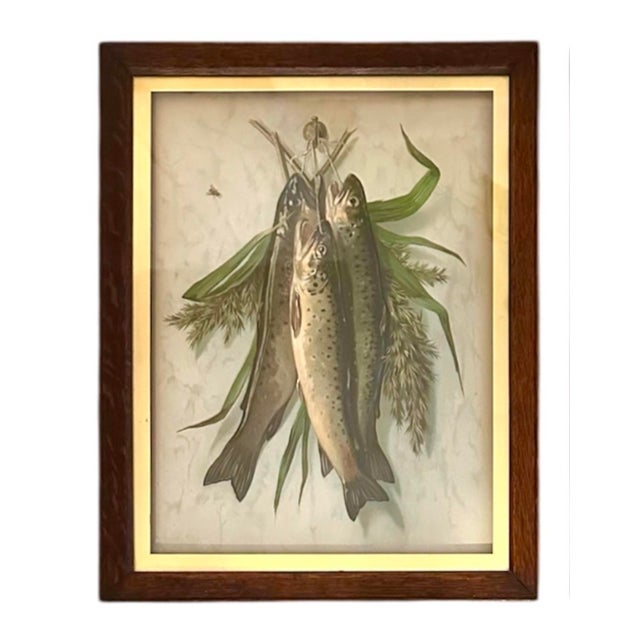 A charming pair of antique hunt trophy prints. Each features a stylized group of hanging fish, “The Day’s Catch”. Embossed...