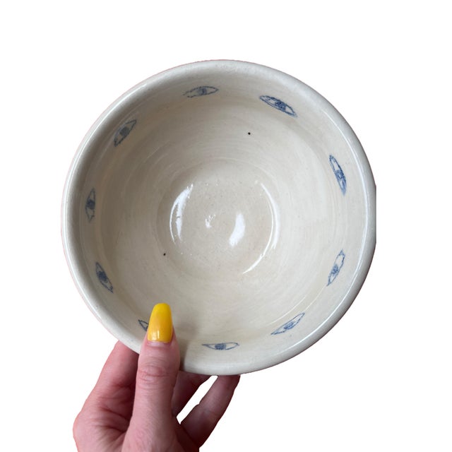 Hand-thrown clay bowls made by keraclay, Brooklyn ceramist Virginia Felix. This set of four bowls are a light sandy beige...