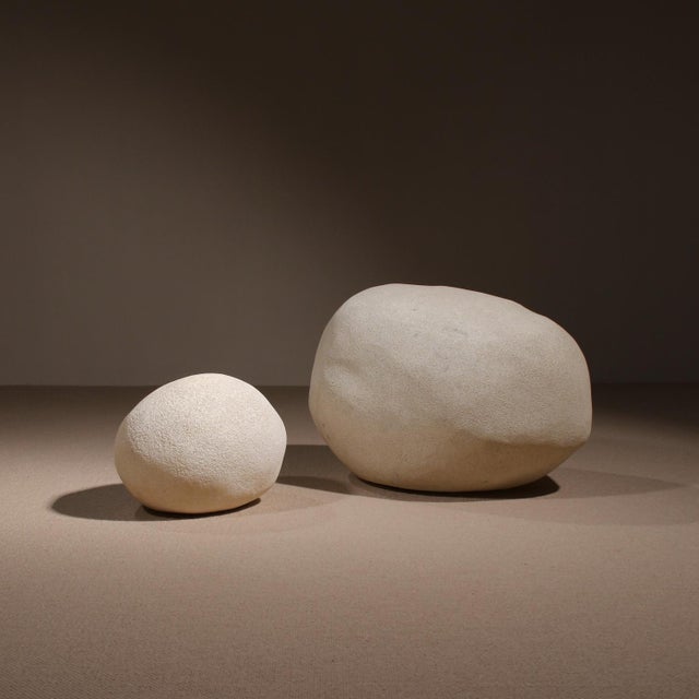 A captivating pair of sculptural lamps that evoke a mystical lunar landscape through their organic form and surface...