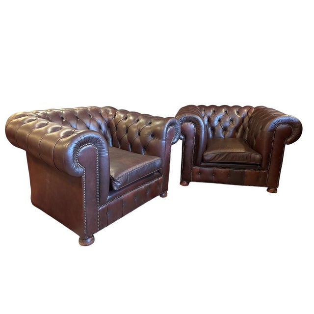 Traditional Chesterfield armchairs with genuine leather, deep button tufting rolled arms and studded detailing. Beautiful...