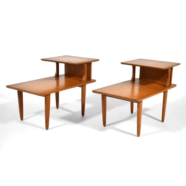 These Heywood Wakefield end tables are a classic mid-century form – the two-tiered "Step" end table. Wakefield produced a...
