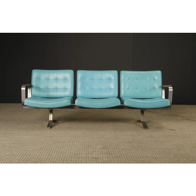 A striking example of mid-century American contract design, this three-seat tandem sofa was sourced directly from the Long...