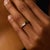 This elegant vintage band showcases a refined alternating design of 6 baguette cut diamonds and 6 step cut emeralds, each...