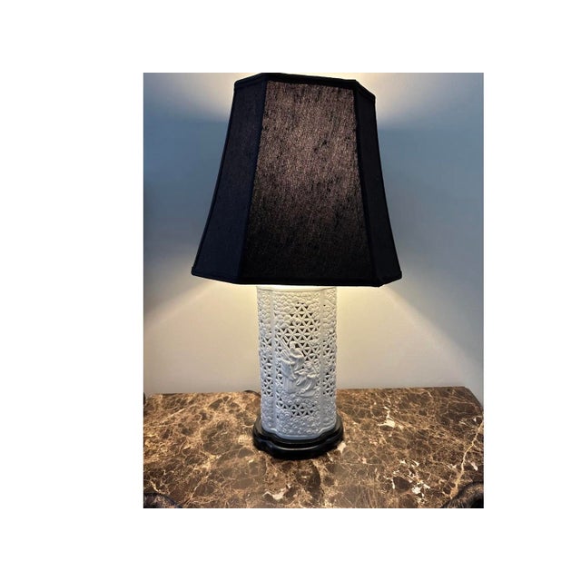 Porcelain white balance De Chine table lamp is in great condition. Silk lamp shade in good condition. May want to change...