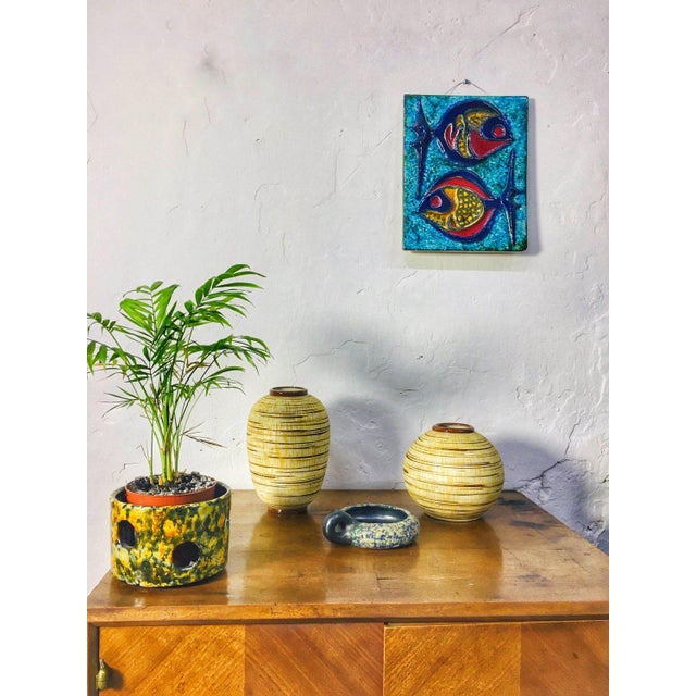 A pair of Austrian Art Deco Amphora majolica vases from the 1920s–1930s. The bottoms of the vases feature the authentic,...