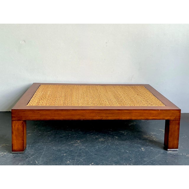 This vintage woven rattan “Modern Barn” coffee table beautifully captures the relaxed sophistication and timeless coastal...