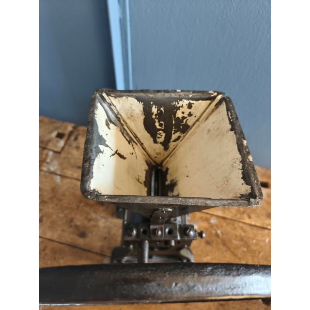 This poppy seed grinder was probably made at the end of the 19th century, and is made of cast iron. It was usually used in...