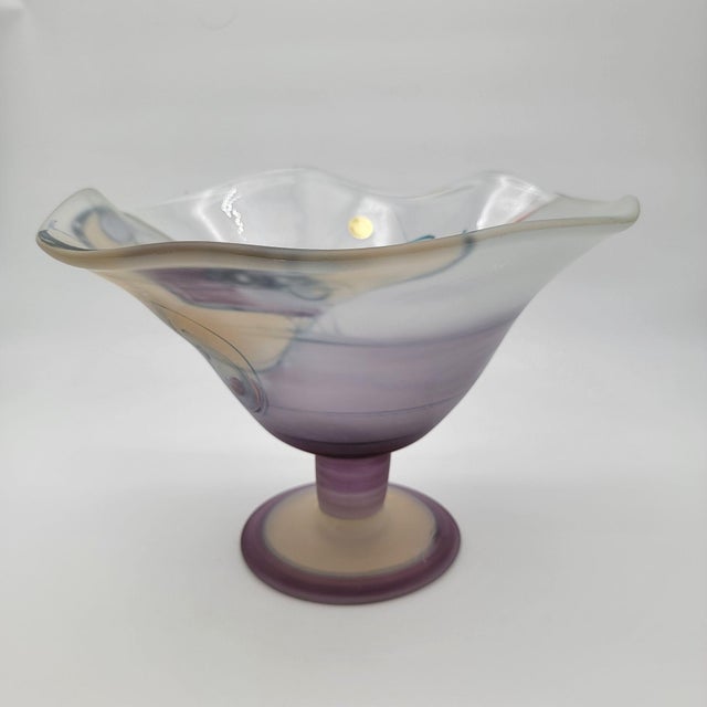 This stunning Ioan Nemtoi art glass compote features a hand-blown design with abstract patterns and soft purple hues....