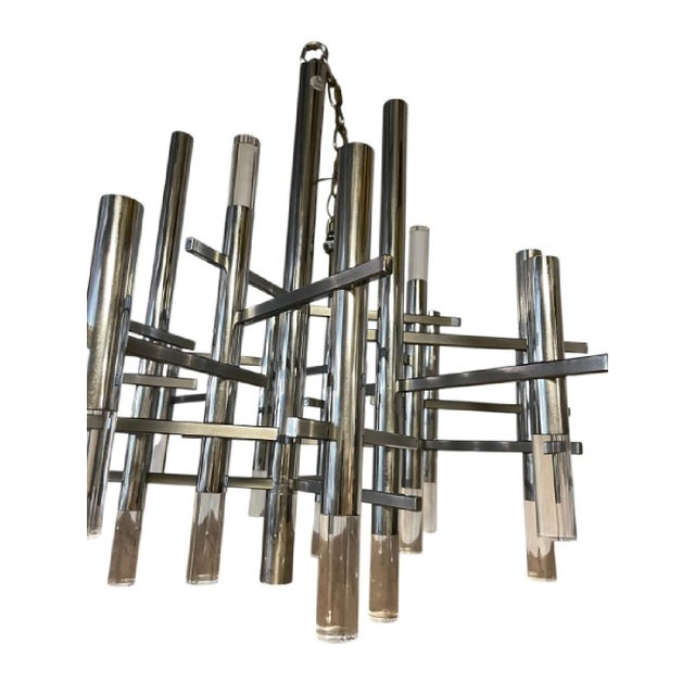 A 1960's large chrome and Lucite rod chandelier designed by Gaetano Sciolari. The chandelier has a striking architectural...