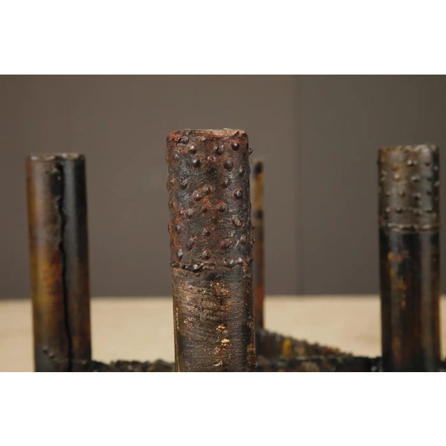 This exceptional Brutalist coffee table by Paul Evans, created as part of his celebrated Sculptured Metal Collection for...