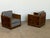 European Art Deco club armchairs in burl walnut and veneered wood, 1930s, sold as a pair. Each chair is built in a strict...