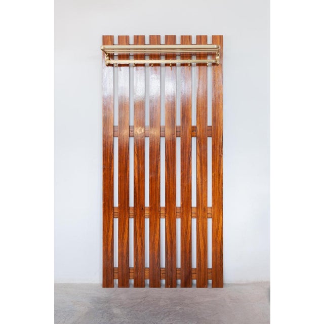 Beautiful modern 1960s wall mounted large coat and hat rack. Mid century large wall mounted coat and hat rack in wood,...