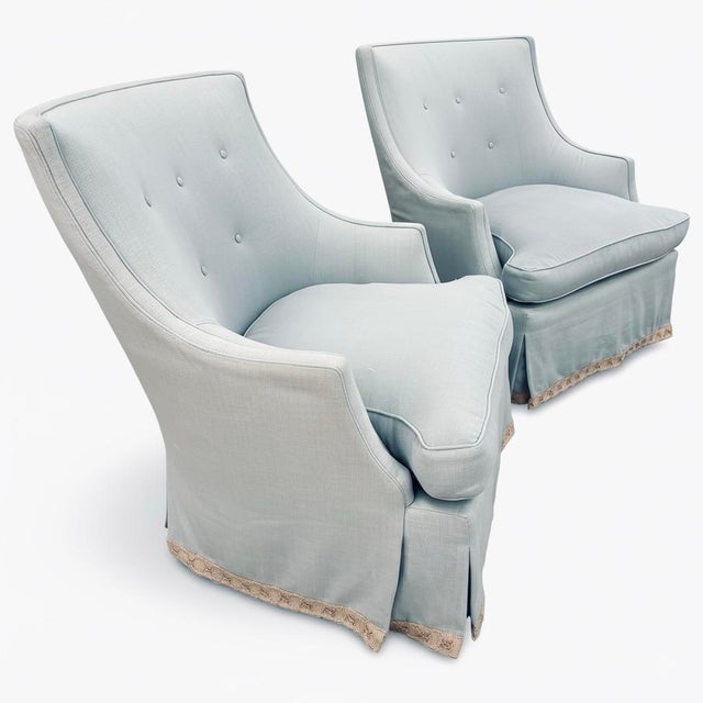 Charming pair of custom slipper chairs upholstered in an ice blue linen with tailored skirts and subtle button-tufted...