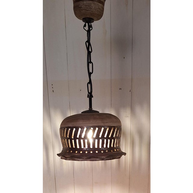 Vintage Rustic Ceiling Lamp with Beige-Brown Ceramic Shade on a Black Iron Chain, 1970s, in Good conditions. Designed 1970...