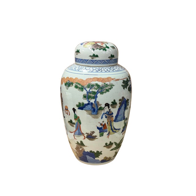This large, ovoid-shaped porcelain ginger jar features a vibrant, wrap-around narrative scene rendered in a palette of...