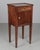 A Country French side table, or nightstand, made of solid walnut, with a small dovetailed drawer and cabinet door, each...