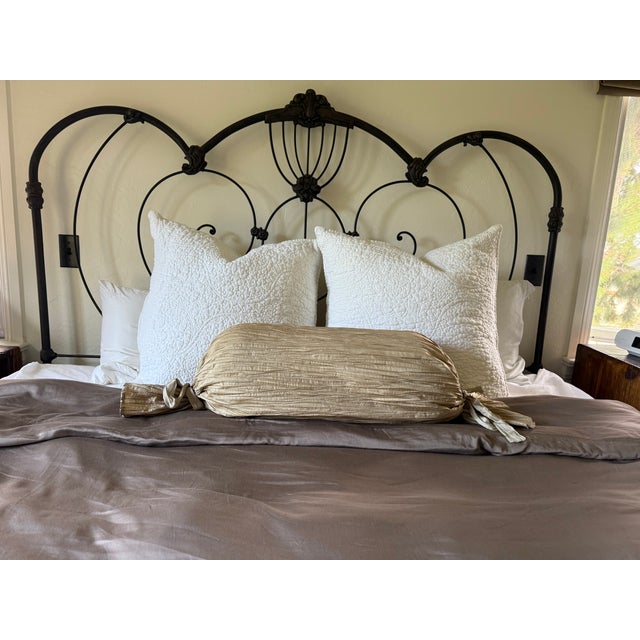 Two champagne colored silk pillows. Circular one is from designer Anne Gish and has 7 layers of gathered ruffles The...