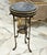 Discover a truly distinctive accent piece with this elegant side table, featuring a round dark marble top framed by a...