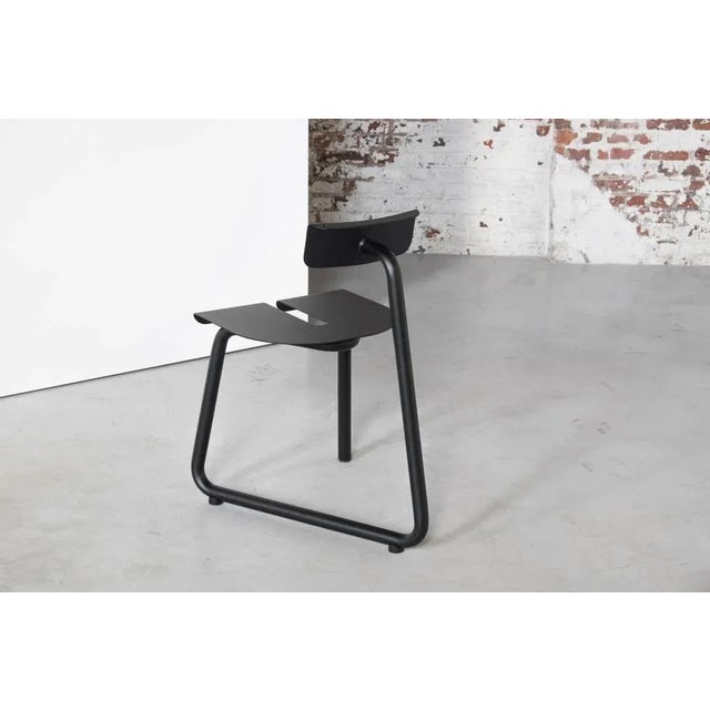 Spc black chair by atelier thomas serruys dimensions: d65 x w43 x h46 materials: steel, powder coated steel chair made of...