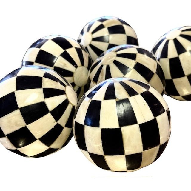 A collection of six beautiful late 19th century horn and bone Victorian carpet balls. Each ball displays alternating...