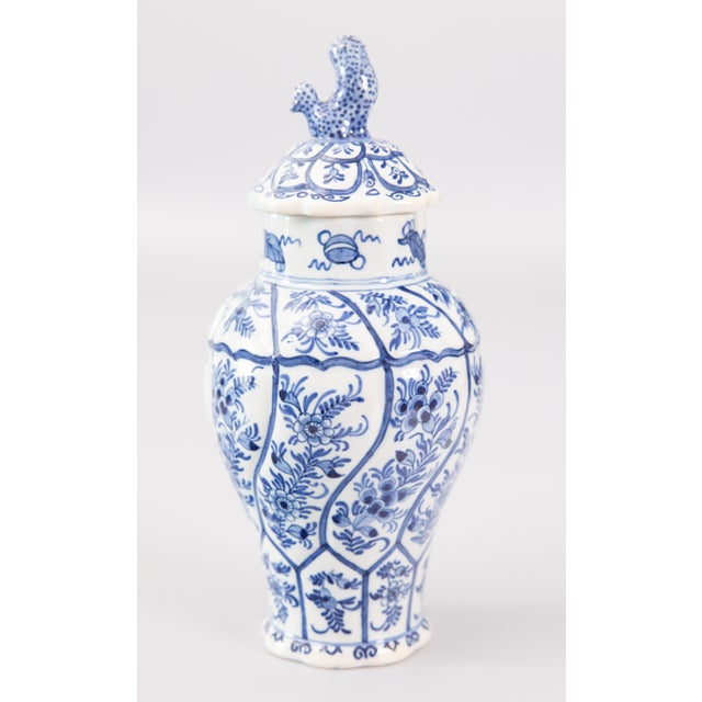 A lovely petite antique Delft Chinoiserie faience cobalt blue and white lidded vase by Boch Keramis, a well-known Belgian...