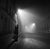 Paris At Night PARIS FRANCE - NOVEMBER 1: A couple embrace on a foggy street at night on November 1 1948 in Paris, France....