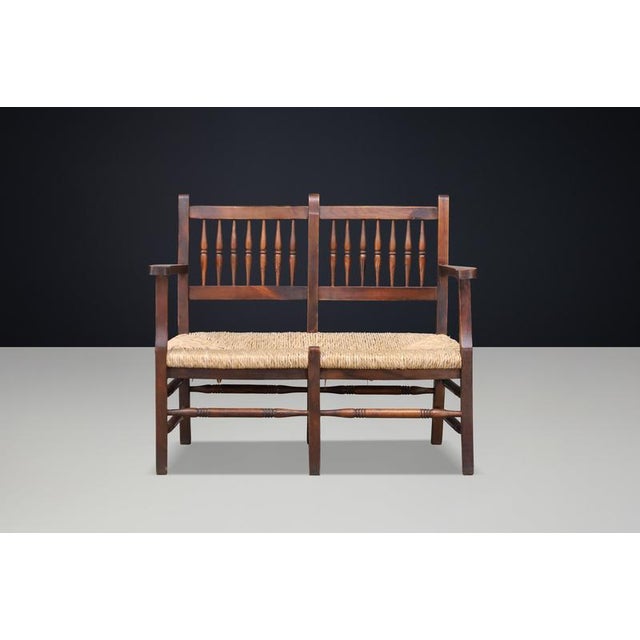 French Patinated Beech and Rush Two-Seat Bench, France, 1950s A charming and unusually compact French two-seat bench,...