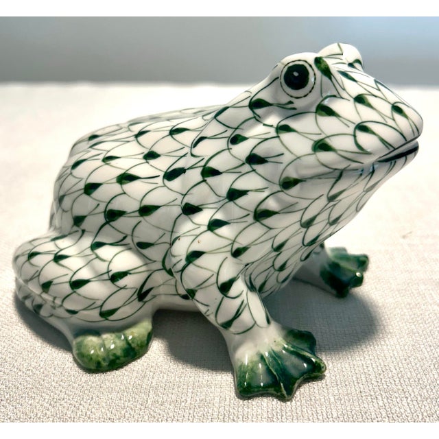 Whimsical and collectible porcelain frog featuring the signature hand-painted fishnet design inspired by classic European...