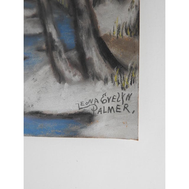 Small early 20th century pastel on paper winter landscape painting. Snow covered forest, stream and cabins. Signed Leona...