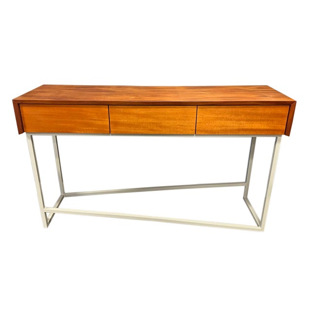 A mahogany and steel table titled "15-Degree Buffett Table" by the American designer Ben Schmitt. This contemporary...