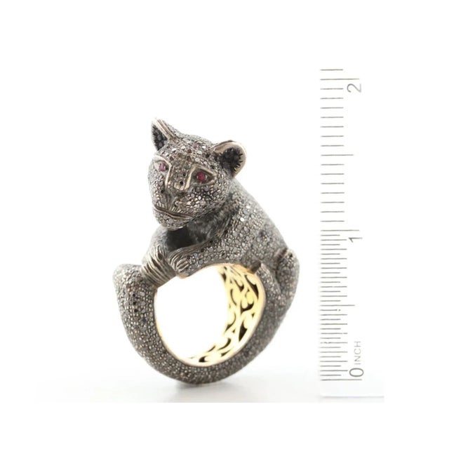 This is part of Chairish’s Fine Jewelry assortment. Amazing Designer Black Diamond 14 K and Sterling Ruby Panther Ring....