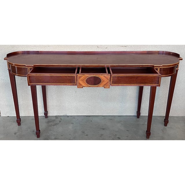 Early 20th French oval demilune large console table with marquetry and drawers. Beautiful piece with wood gallery top with...