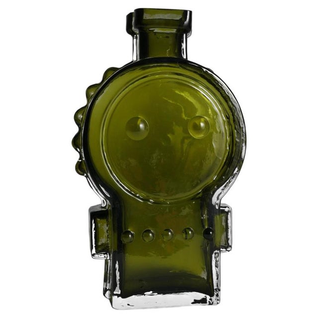 A delightful and highly sculptural olive green glass vase designed by the acclaimed Helena Tynell for Finnish glassworks...