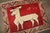 a 3rd quarter of the 20th century Gabbeh Rug depicting a deer on a madder red field