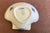 Sculptural seashell shape ribbed body with tiny hand painted floral accents at base. Traditionally used as a butter dish,...